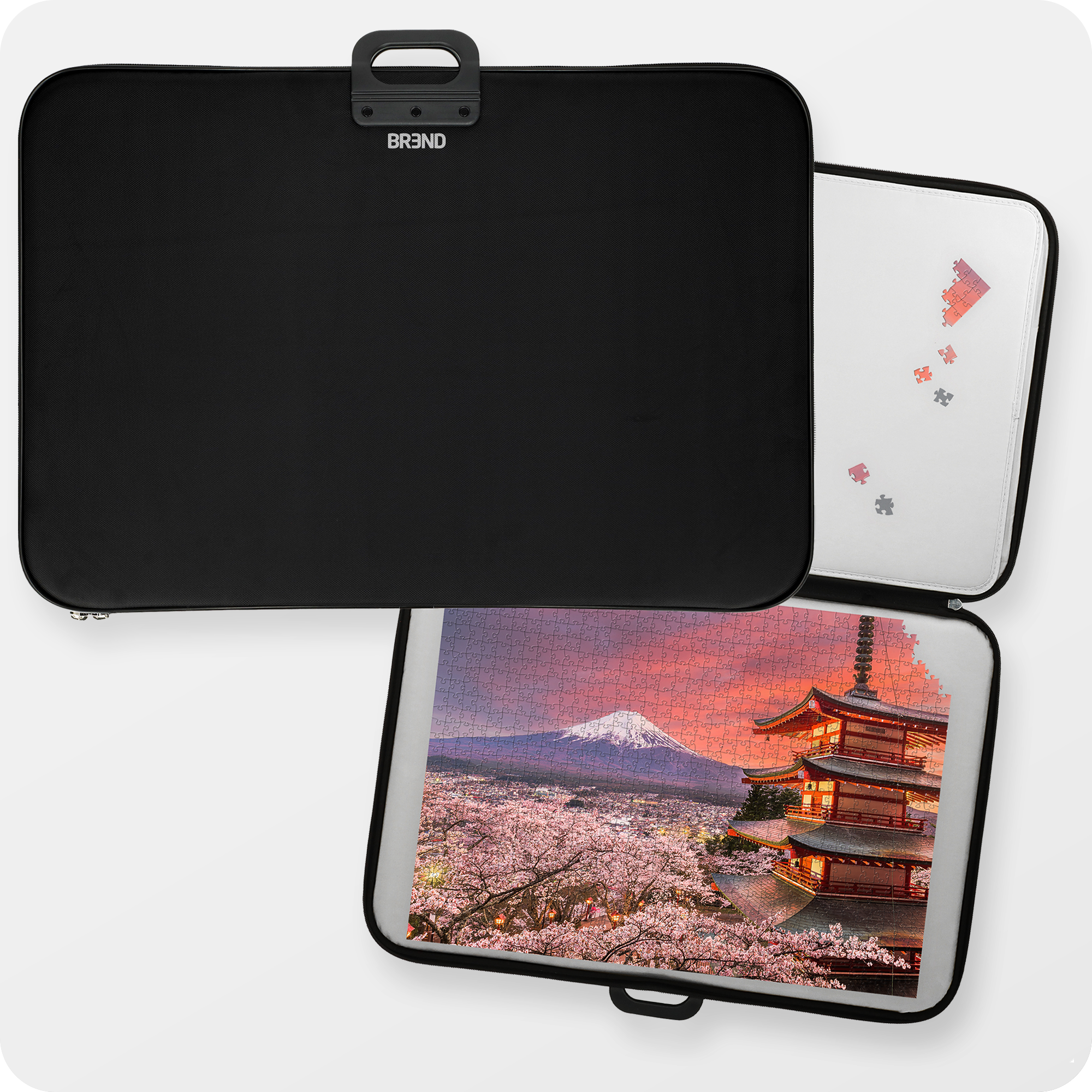 Bovenaanzicht van de zwarte puzzelmap met een puzzel van 1000 stukjes erin. Op de puzzel staat Japan, Tokyo met Mount Fuji erop.